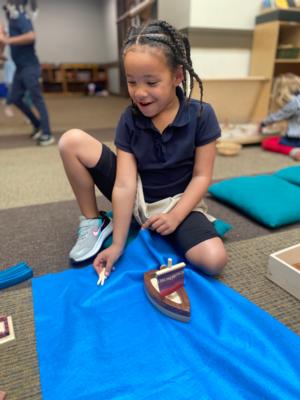 A St. Elizabeth's School kindergartener playing during free play time in Chapel.  