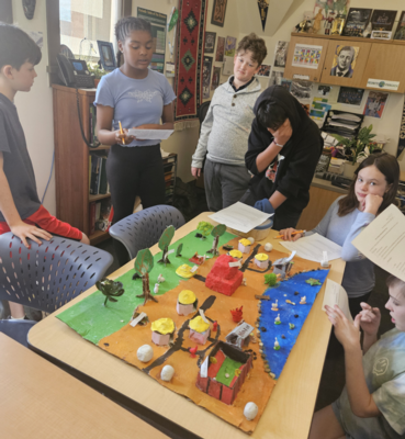 Middle Schoolers Collaborate on a Social Studies Project in Social Studies