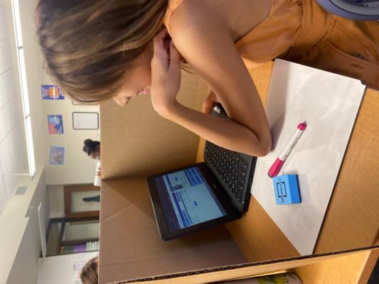 Middle School Girl Works on Computer Math at St. Elizabeth's in Denver