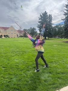 a middle school girl strikes a pose during badminton practice