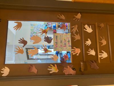 The St. Elizabeth's kindergarten classroom features paper hands representing each student