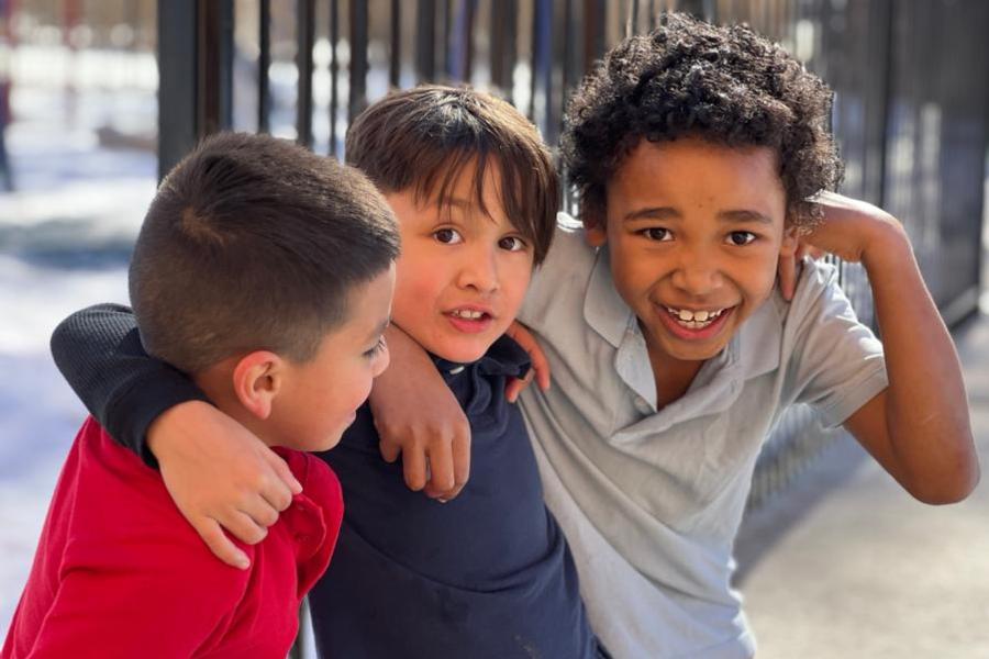 Elementary-aged-boys,-children,-students-diversity-smiles,-happy,-looking-at-camera,-school-community-St.-Elizabeth's-School-Denver