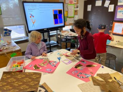 Two second grade girls create art at St. Elizabeth's School in Denver